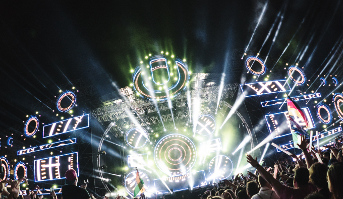 Concert Lights with Crowd with Arms Raised
